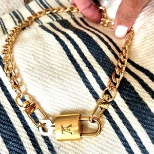 Louis Vuitton Padlock Lock and Key with free 16” gold chain. #301.